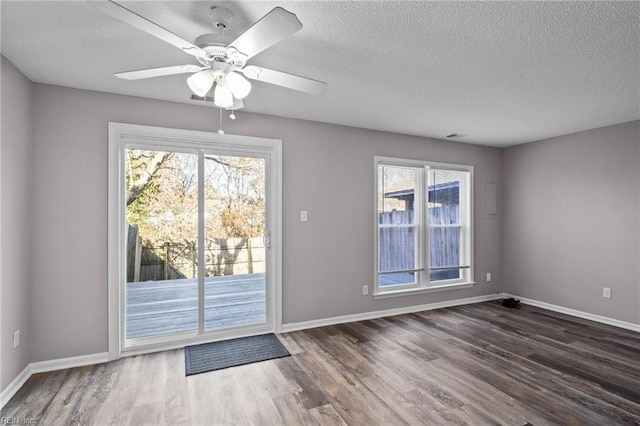 doorway featuring dark hardwood / wood-style floors and a textured ceiling