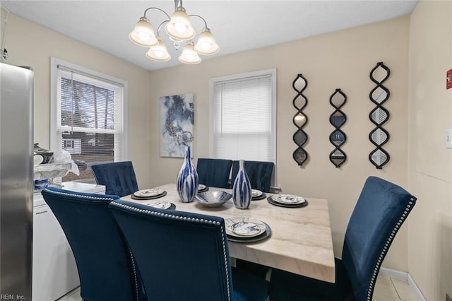 dining area with a chandelier