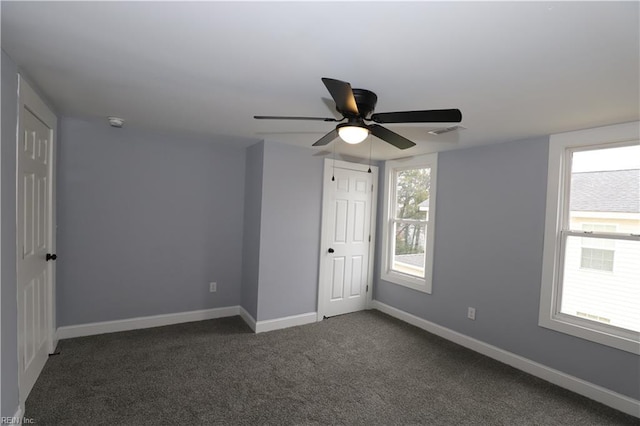 carpeted empty room with ceiling fan