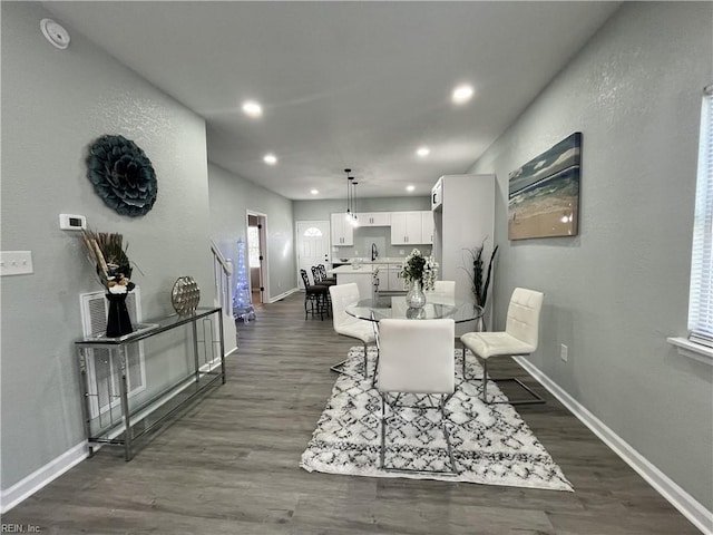 dining space featuring dark hardwood / wood-style flooring