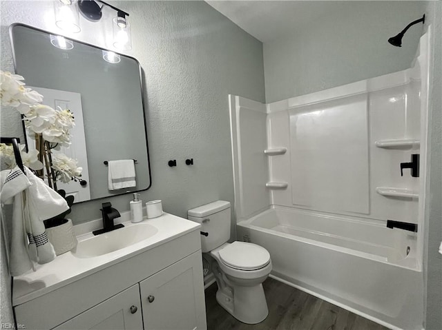 full bathroom with shower / tub combination, hardwood / wood-style floors, vanity, and toilet