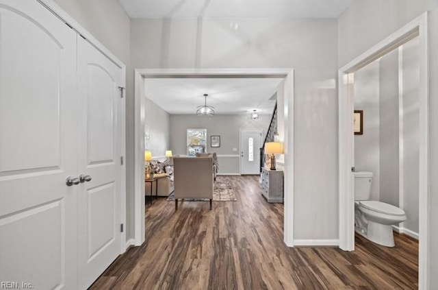 corridor with dark hardwood / wood-style floors