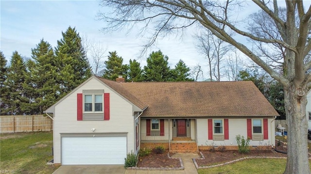 view of front of house with a front lawn and a garage