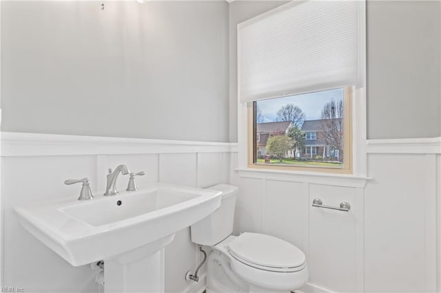 bathroom featuring sink and toilet