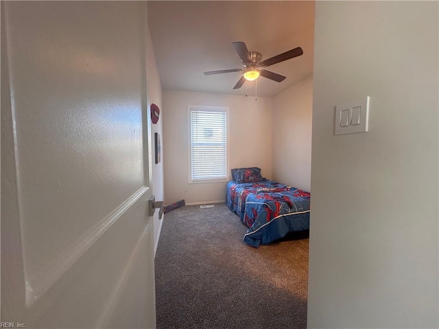 bedroom with ceiling fan and carpet