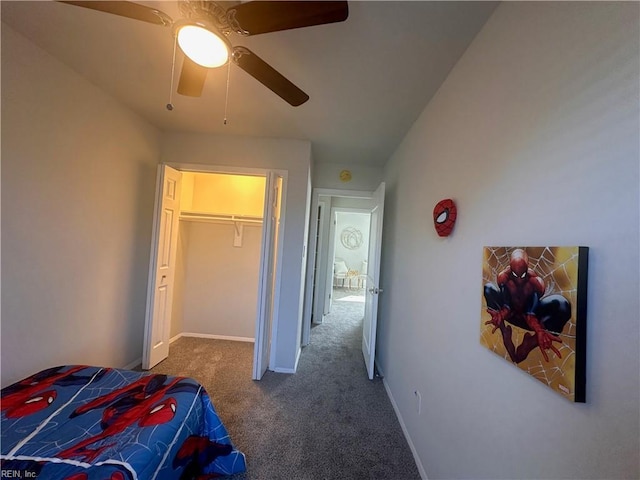 bedroom featuring ceiling fan and dark colored carpet