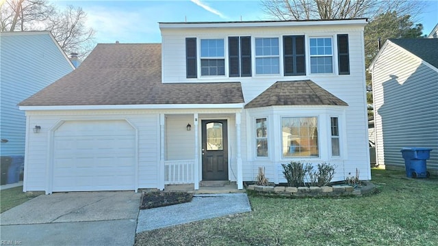 front of property with a garage and a front yard