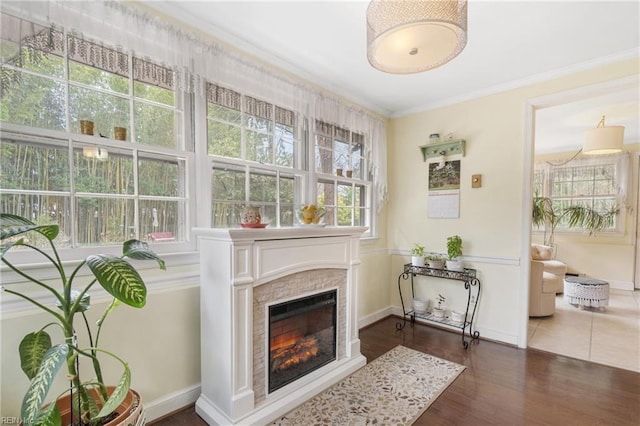 sitting room with crown molding and dark hardwood / wood-style floors