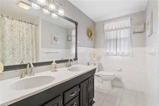 bathroom with toilet, tile walls, ornamental molding, vanity, and tile patterned flooring