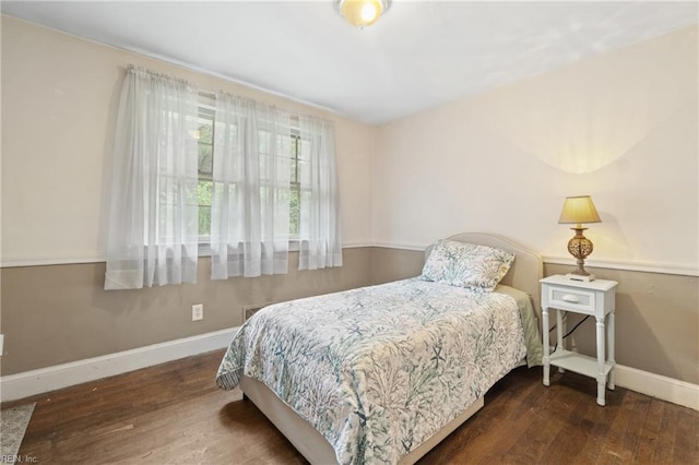 bedroom featuring dark hardwood / wood-style flooring