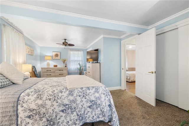 bedroom with ornamental molding, ceiling fan, and carpet