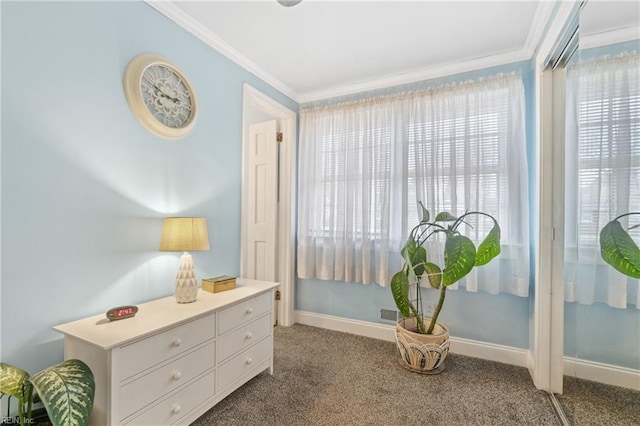 sitting room featuring ornamental molding and carpet