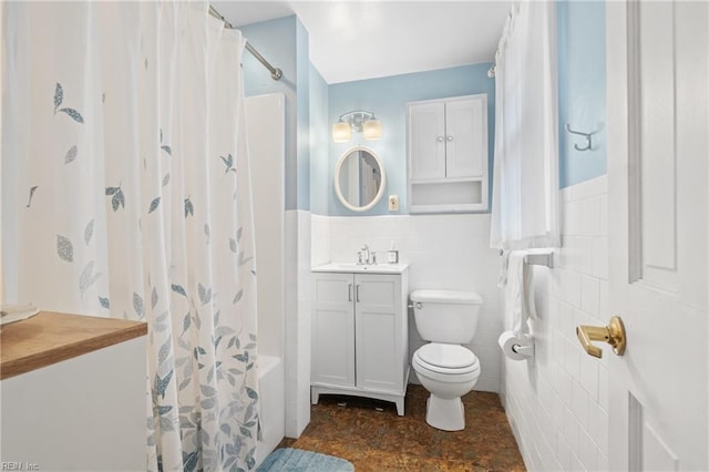 full bathroom featuring tile walls, vanity, toilet, and shower / tub combo with curtain