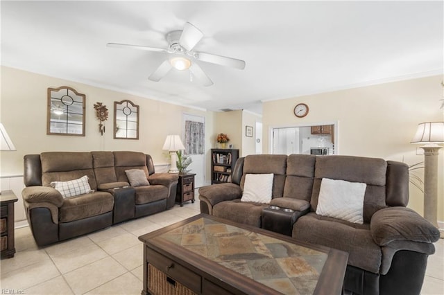 tiled living room featuring ceiling fan