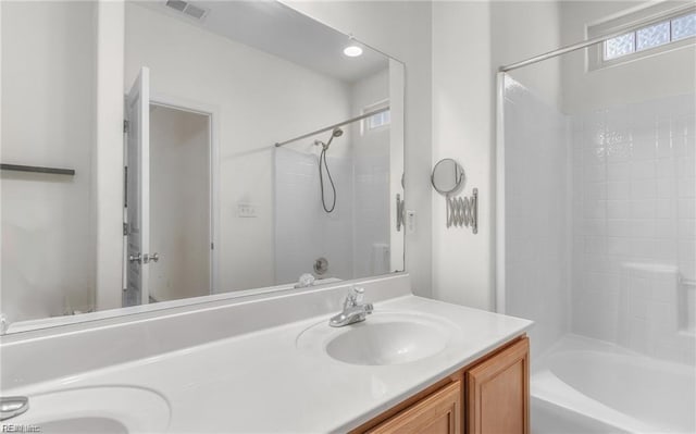 bathroom featuring vanity and shower / washtub combination