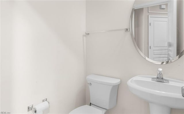 bathroom with sink and toilet