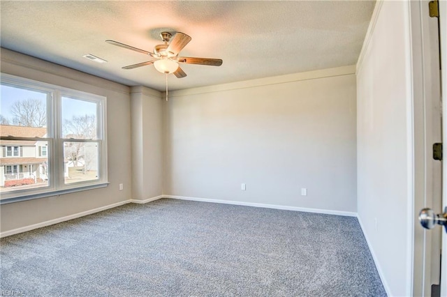 unfurnished room featuring carpet floors, a textured ceiling, and ceiling fan