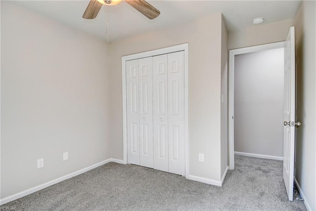 unfurnished bedroom with light carpet, a closet, and ceiling fan