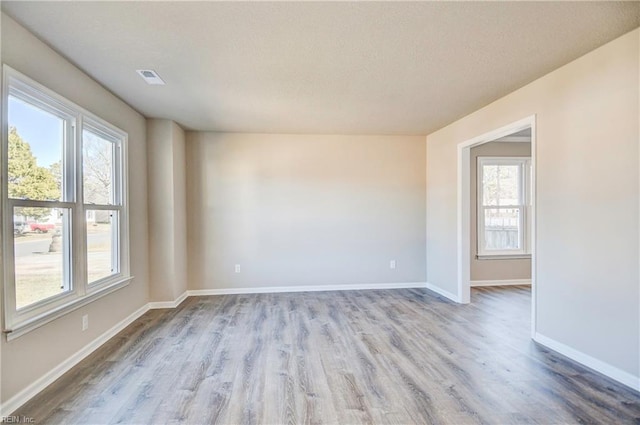 spare room featuring light wood-type flooring