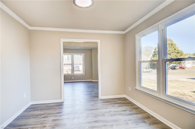 unfurnished room featuring crown molding and hardwood / wood-style flooring