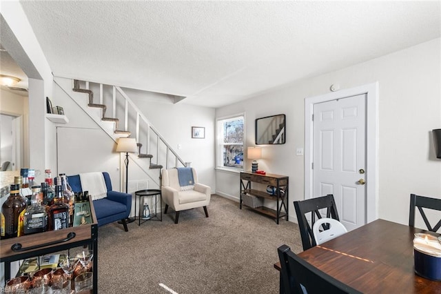 carpeted home office with a textured ceiling