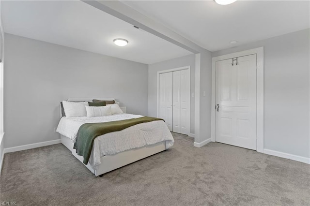 carpeted bedroom with a closet