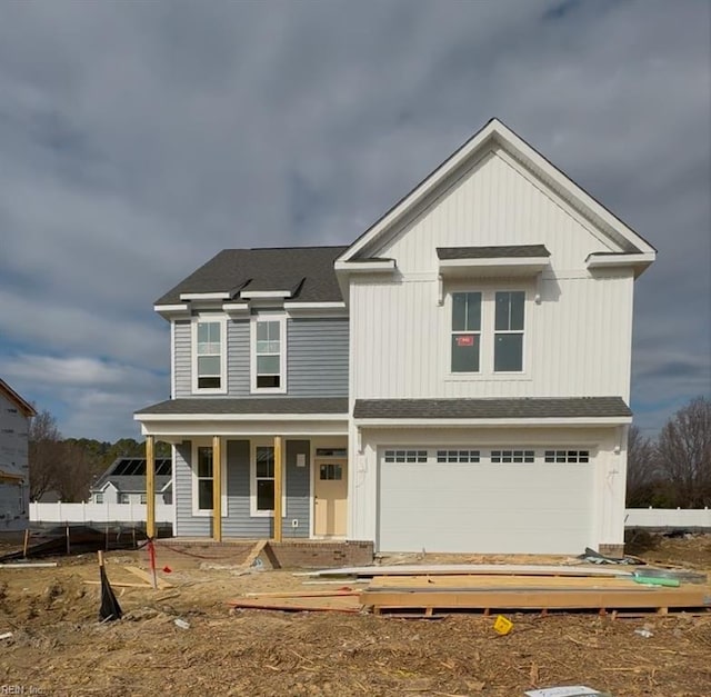 view of front of home with a garage and covered porch