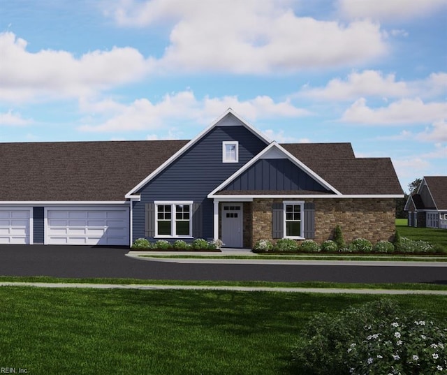 view of front of property featuring a garage and a front yard