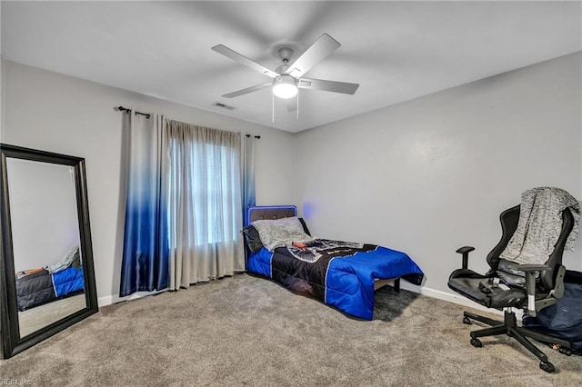 carpeted bedroom with ceiling fan