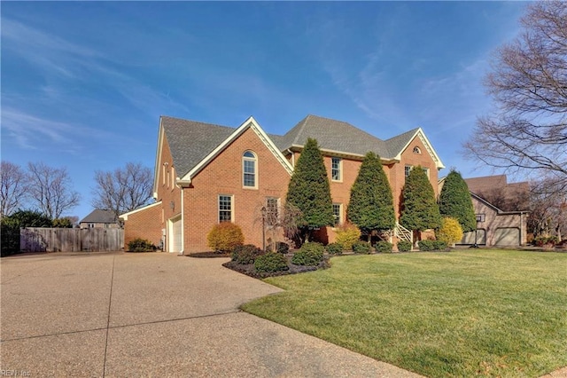 view of front facade with a garage and a front yard