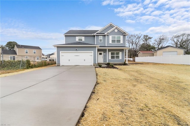 view of front of home featuring a garage and a front yard