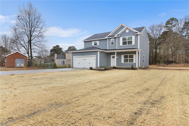 view of front facade featuring a garage and a front yard