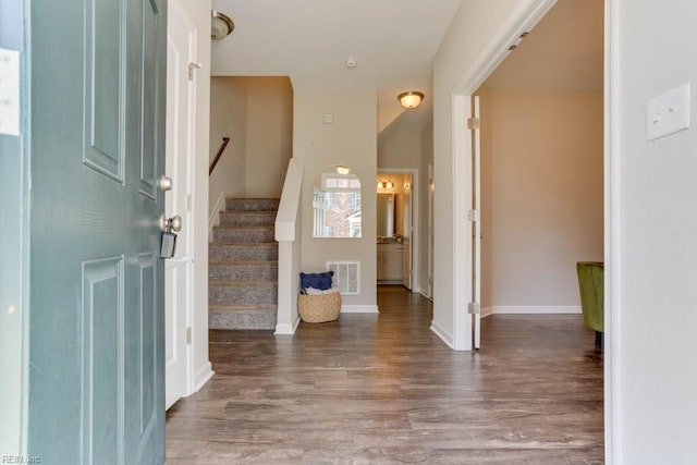 entrance foyer with dark hardwood / wood-style flooring