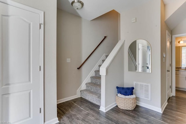 staircase featuring hardwood / wood-style flooring