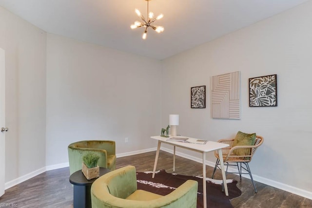 office space with an inviting chandelier and dark wood-type flooring