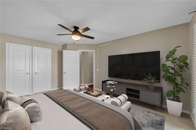 carpeted bedroom featuring ceiling fan