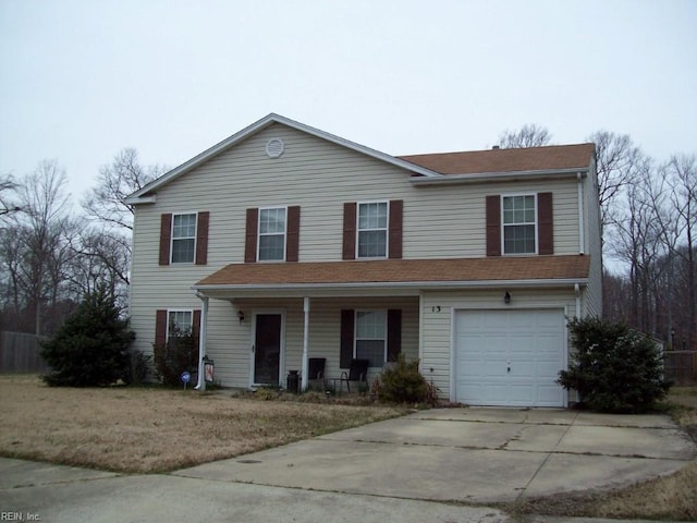 view of front of house with a garage and a front yard