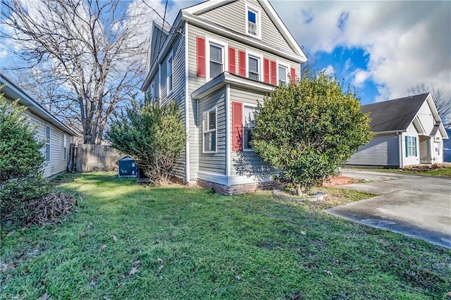 view of property exterior with a lawn