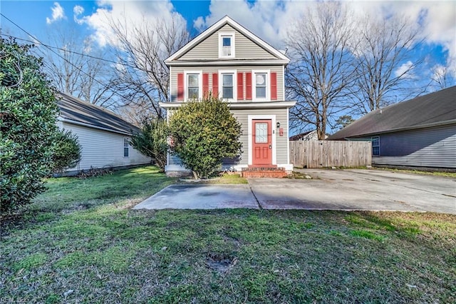 view of front of property with a patio and a front lawn