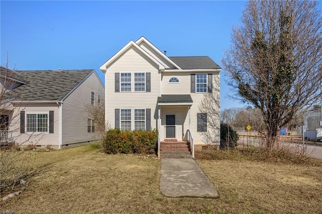 traditional home featuring crawl space, a shingled roof, and a front lawn