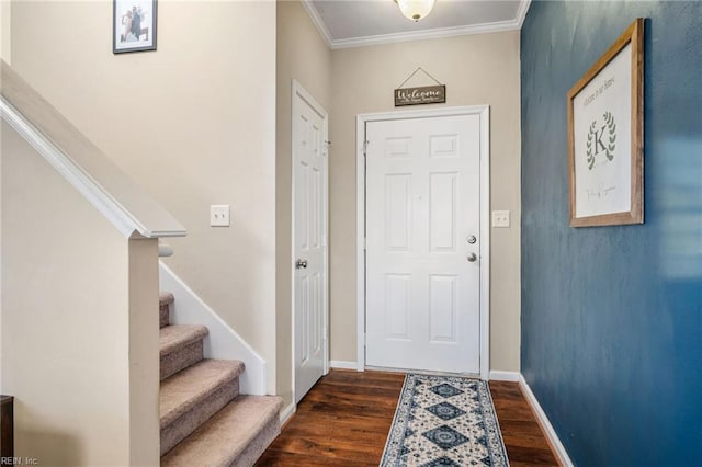 entryway with stairs, baseboards, dark wood finished floors, and crown molding