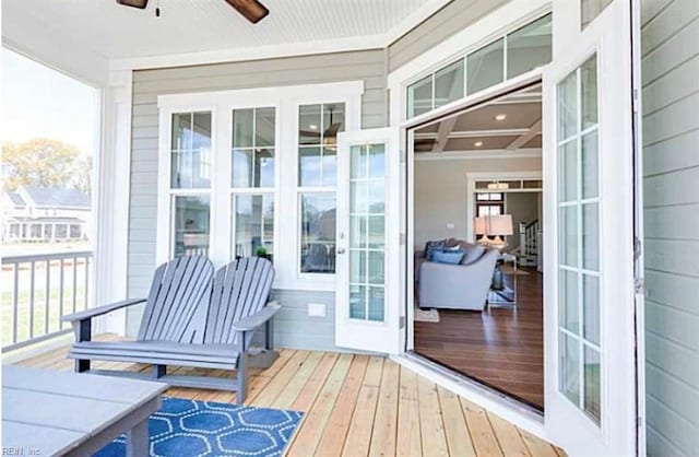 exterior space with ceiling fan