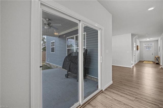 interior space with ceiling fan