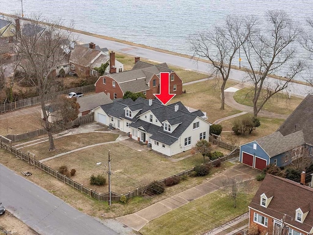 birds eye view of property featuring a water view