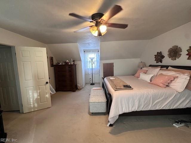 bedroom with light carpet, lofted ceiling, and ceiling fan