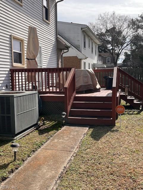 wooden terrace with a lawn and central AC