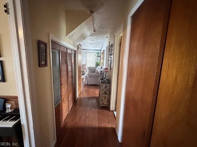 hallway with dark hardwood / wood-style floors