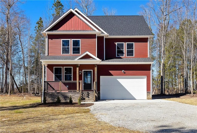 view of front of property featuring a garage and covered porch