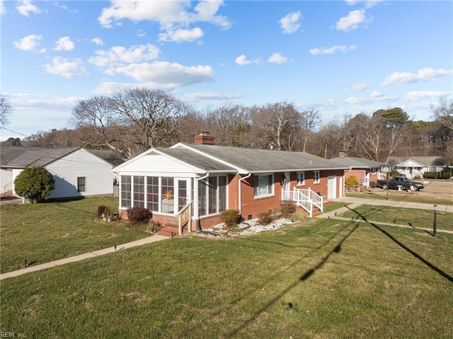 single story home featuring a front lawn and a sunroom