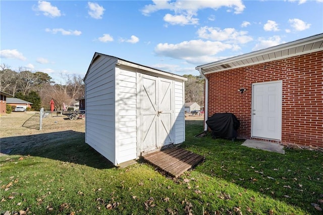 view of outbuilding with a yard